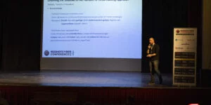 Immagini dello speech di Emanuele De Lucia, CIO Di Duskrise E Team Leader Di Cluster25 e membro del gruppo CTI di Red Hot Cyber, dal titolo "Unveiling the Shadows of INC Ransomware: A Threat Hunting Approach".